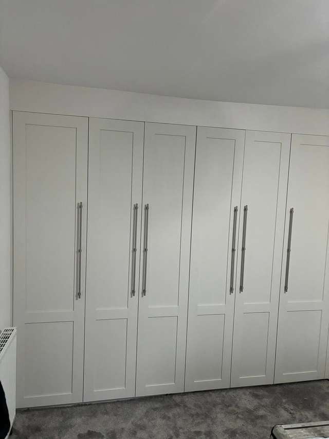 Fitted wardrobes with shaker doors by LMF Joinery