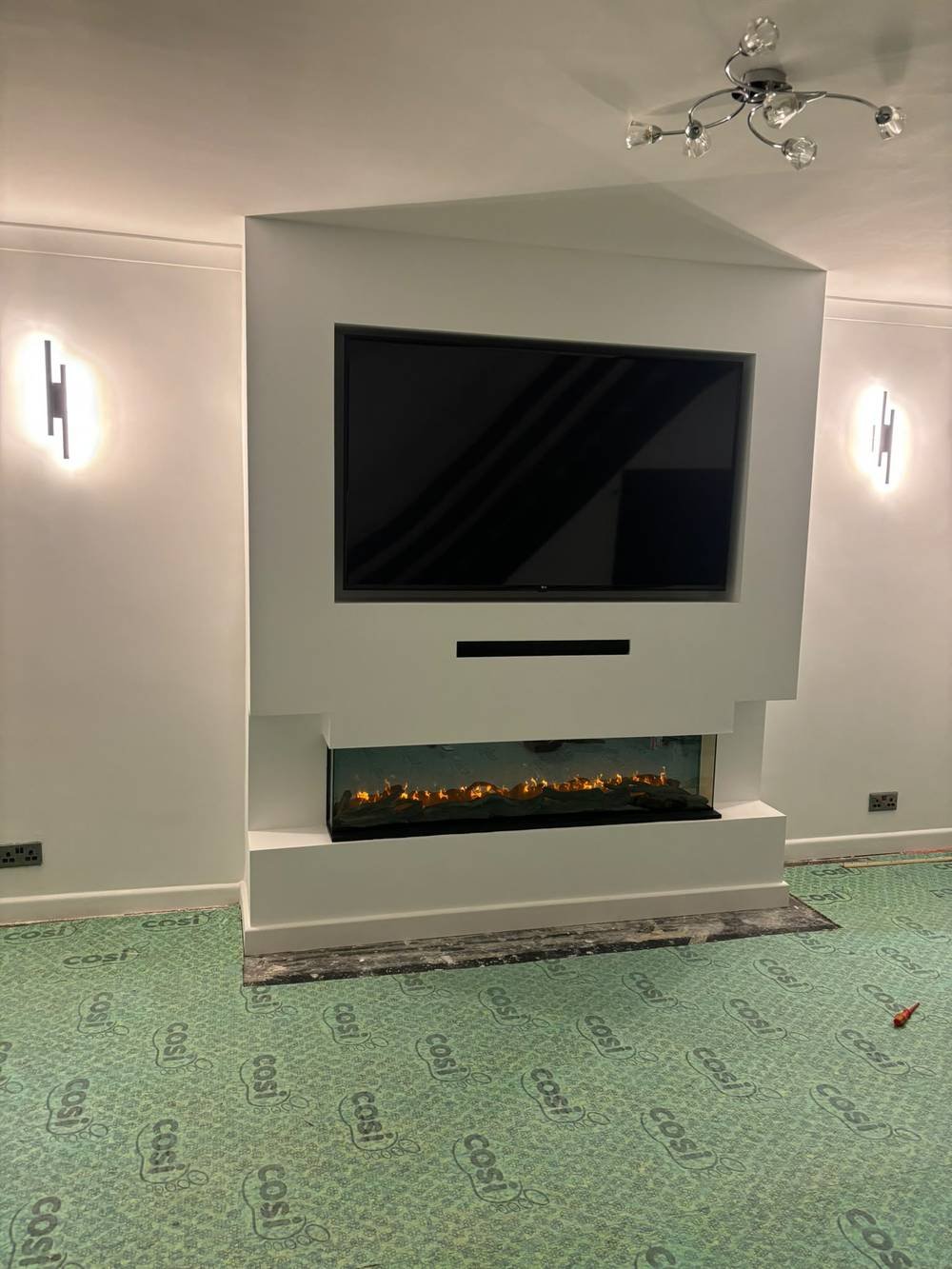 Media wall unit with recessed fire mid-installation