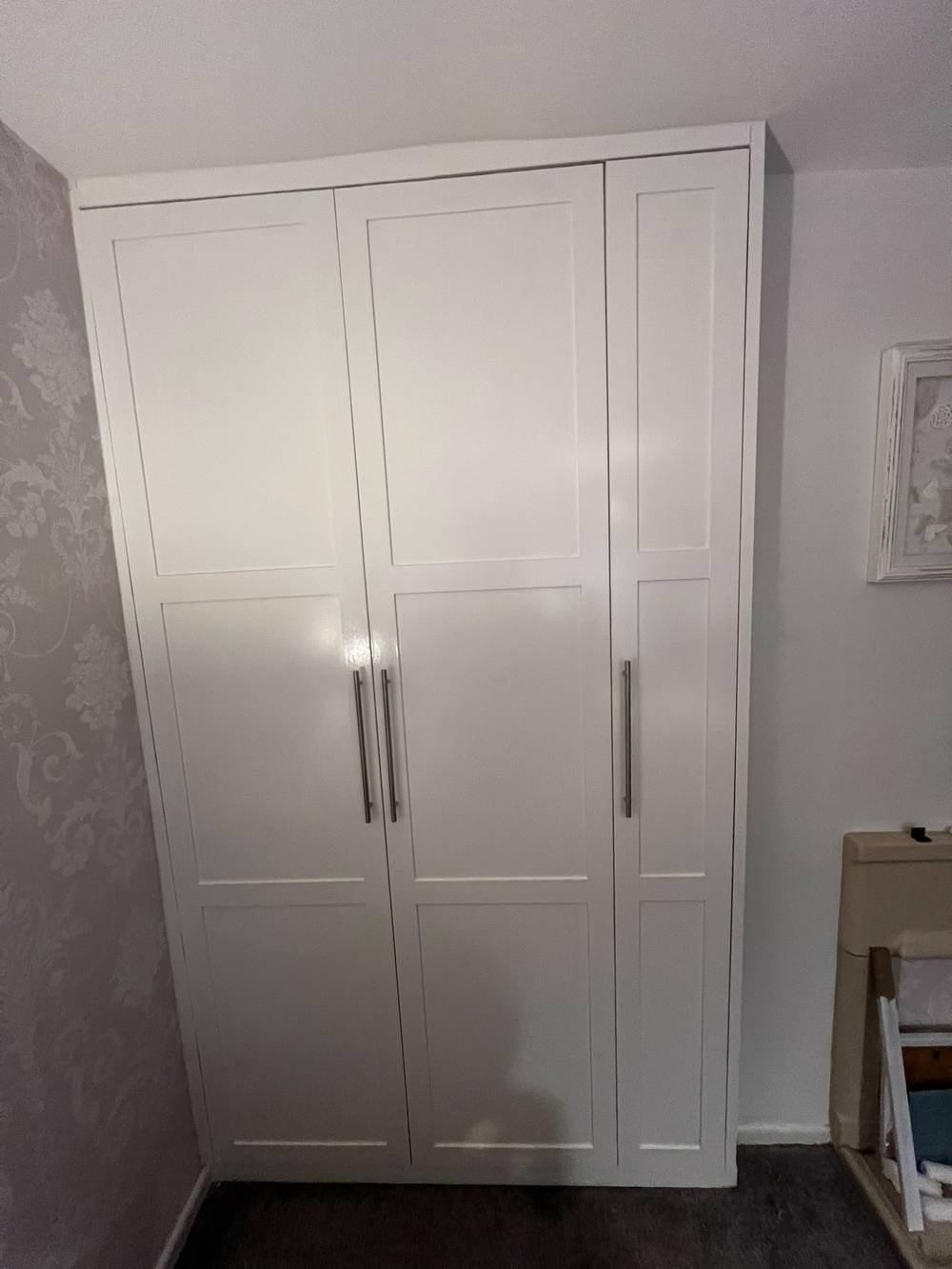 White fitted wardrobe with panelled shaker doors